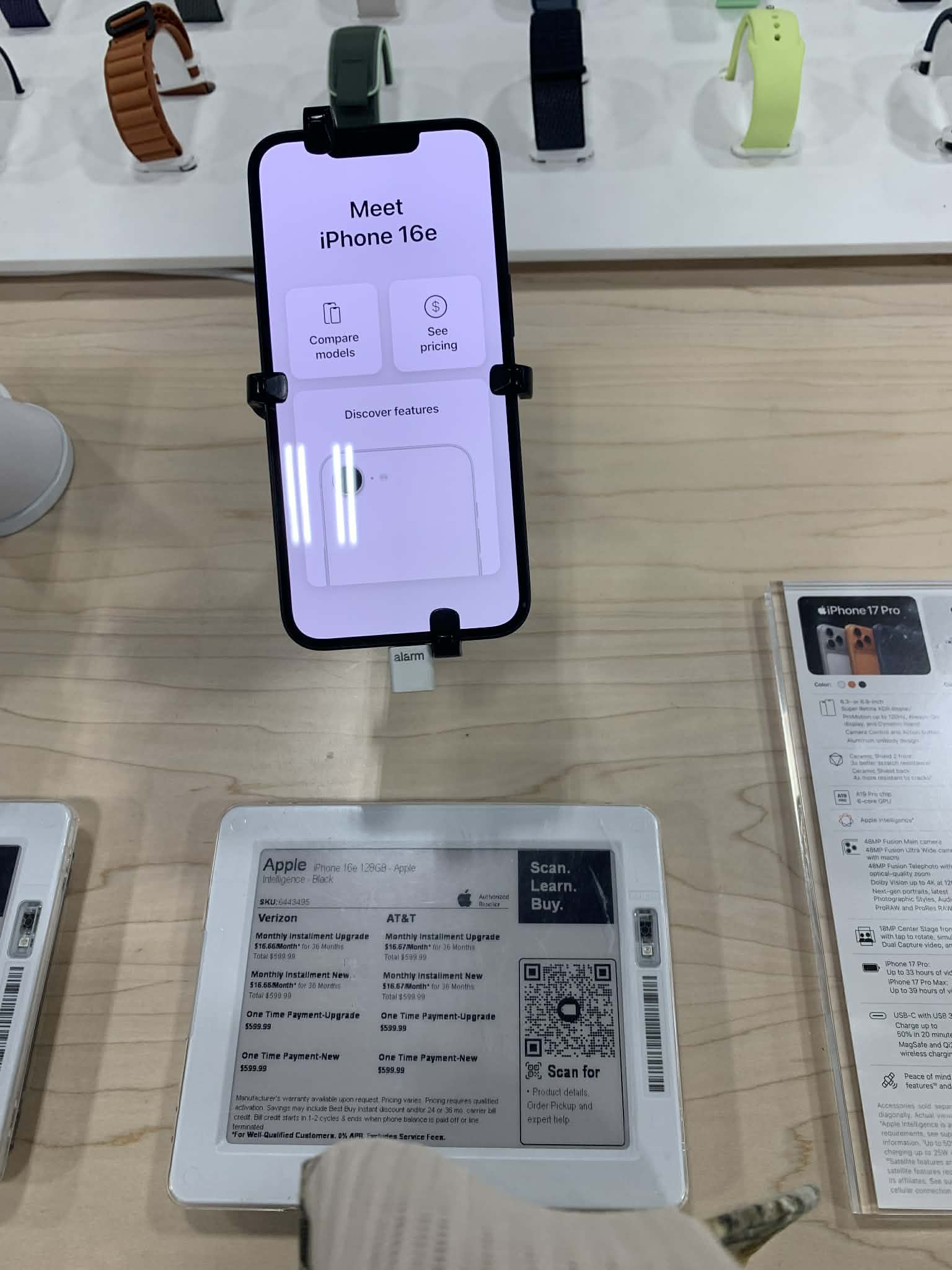 Apple iPhone 16e front and back view showing 6.1-inch OLED display and sleek aluminum design