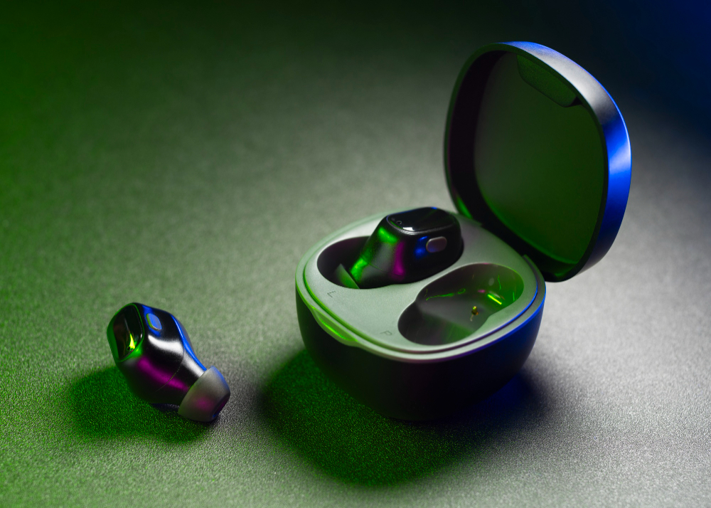 Wireless noise-cancelling earbuds with charging case on dark background featuring modern compact in-ear design