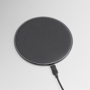 MagSafe car mount with a round magnetic charging pad and attached cable.