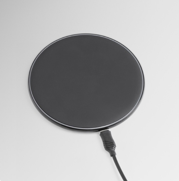 MagSafe car mount with a round magnetic charging pad and attached cable.